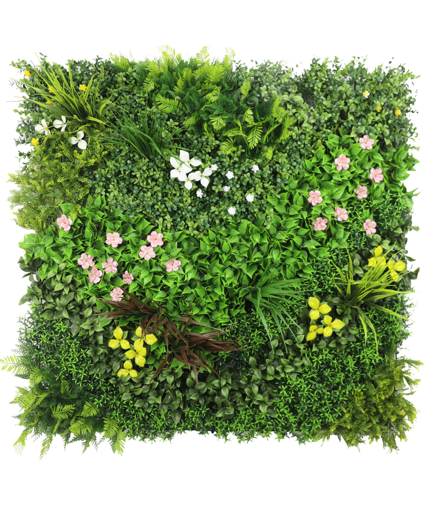 Die künstliche Hecke Vitality 100x100 cm UV ist eine quadratische Platte mit dichtem grünem Kunstlaub und verstreuten Büscheln kleiner rosa, gelber und weißer Blüten vor einem weißen Hintergrund.